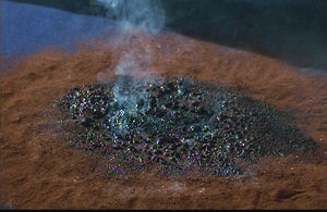 The pile of dust that was once Carter.