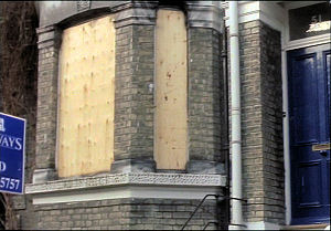 Mike's old house is boarded up