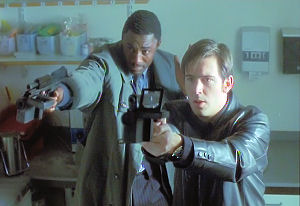 Vaughn and Mike shoot at the fleeing man