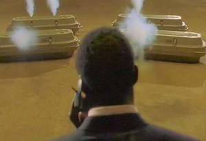 Vaughn is on the phone to Mike while looking at the caskets.  He realises Mike won't get to him in time.